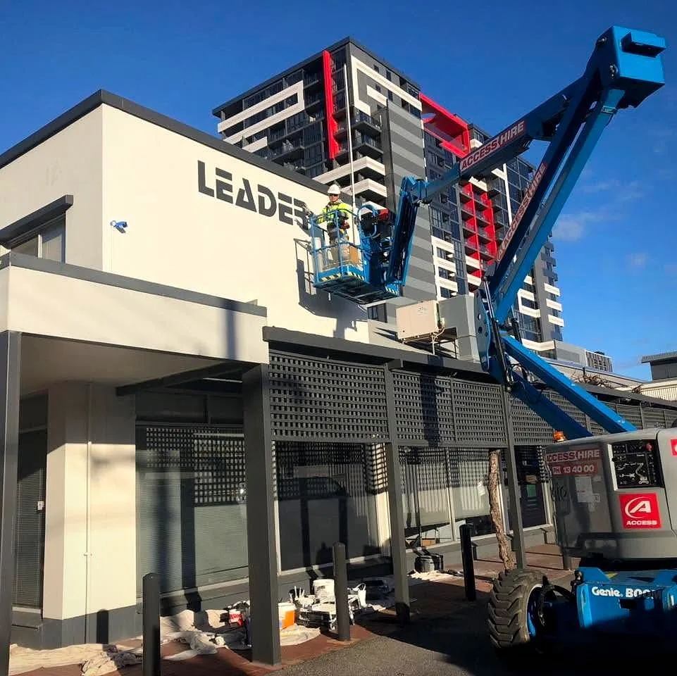 Commercial repaint using a boom lift